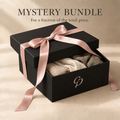 Black Mystery Bundle gift box with blush pink ribbon, CP logo and promotional wording